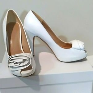 White Pumps with Flower and Peek A Boo Toe..Le Chateau